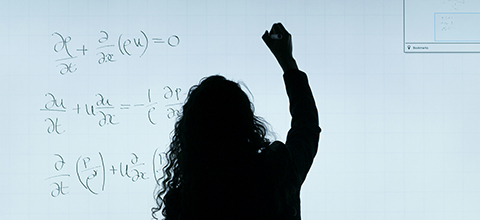 person writing on board