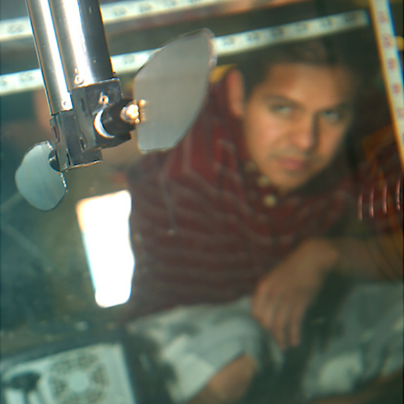 student tests air flow in specialized chamber