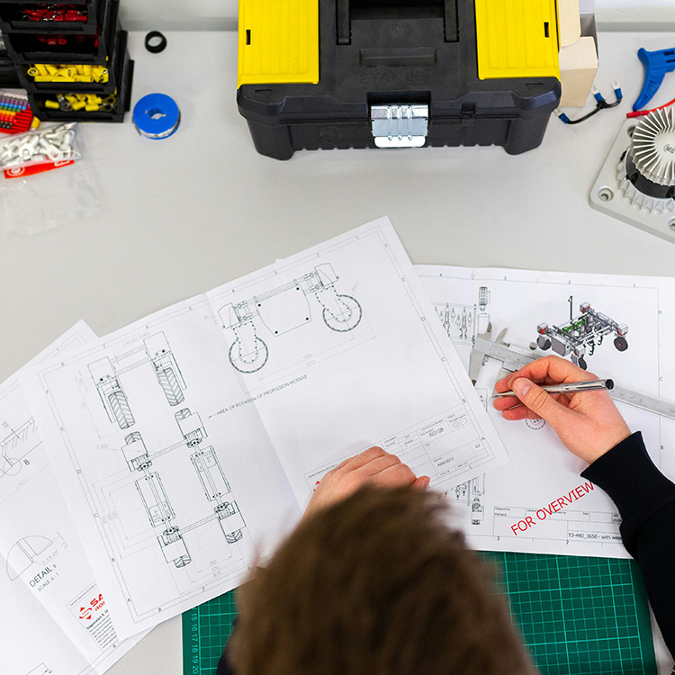 student working on a circuit board