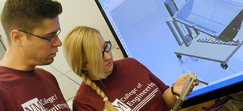 students taking accurate measurement with a specialized instrument