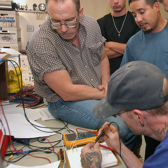 class engaging in electronics