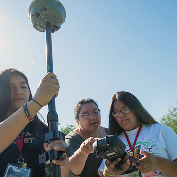 student taking remote measurements