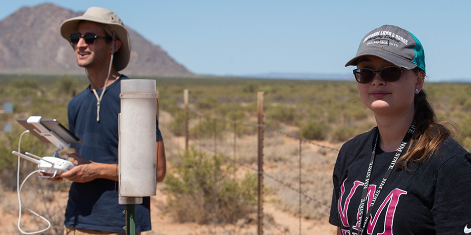 student using surveying instrument