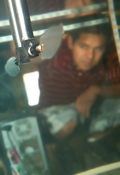 student measuring airflow in a specialized chamber