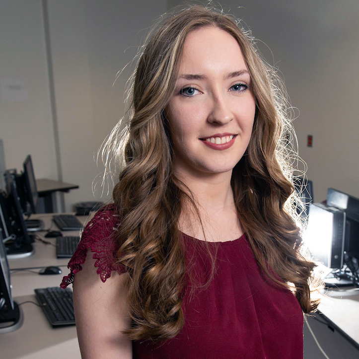 student in front of computers