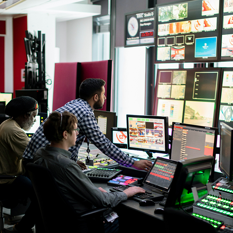 students reading results on screen