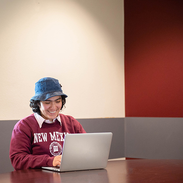 student using laptop at Corbett Center
