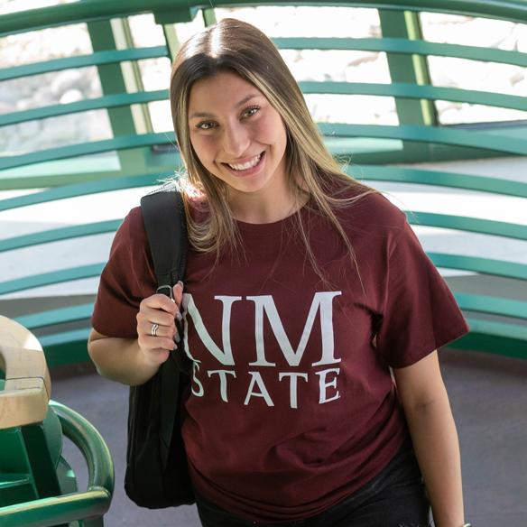 Student posing in stairwell