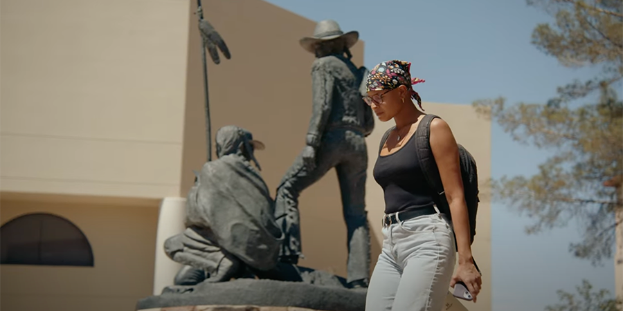 Student walking across campus