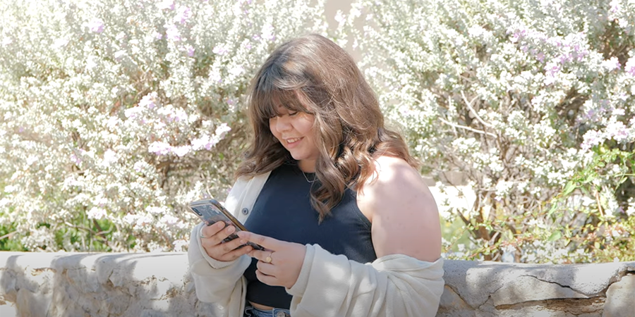 Student looking at their cell phone