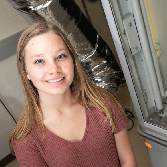 Haley Woolf, demonstrates how she how she obtained the results of her research focusing on Optical and X-ray Characterizations of Ge Sn Alloy on GaAs