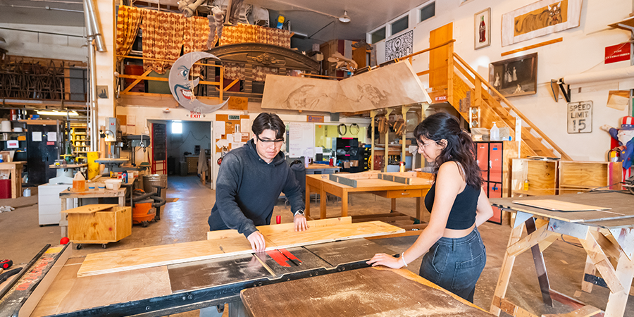 Students working in the theatre scene shop