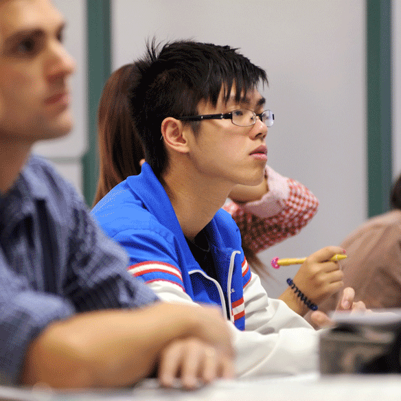 Student paying attention in classroom.