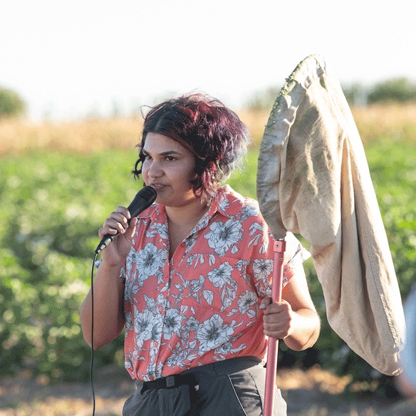 Student speaking at a farm.