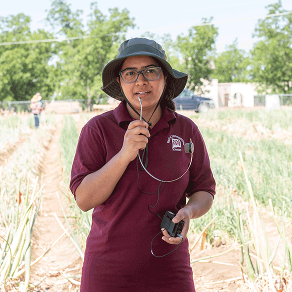 Student speaking at a farming event.
