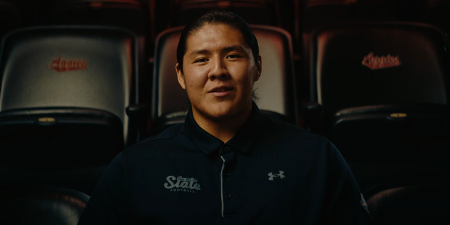 Student sitting staring at the camera