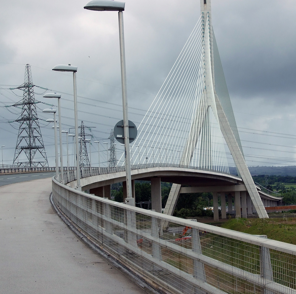 water rushing down a dam causeway