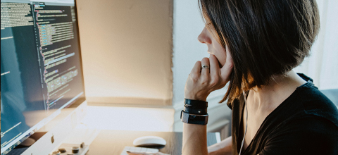 A woman working at her computer