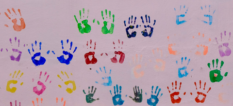 Child handprints displayed on wall