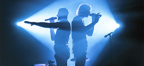 two performers on stage